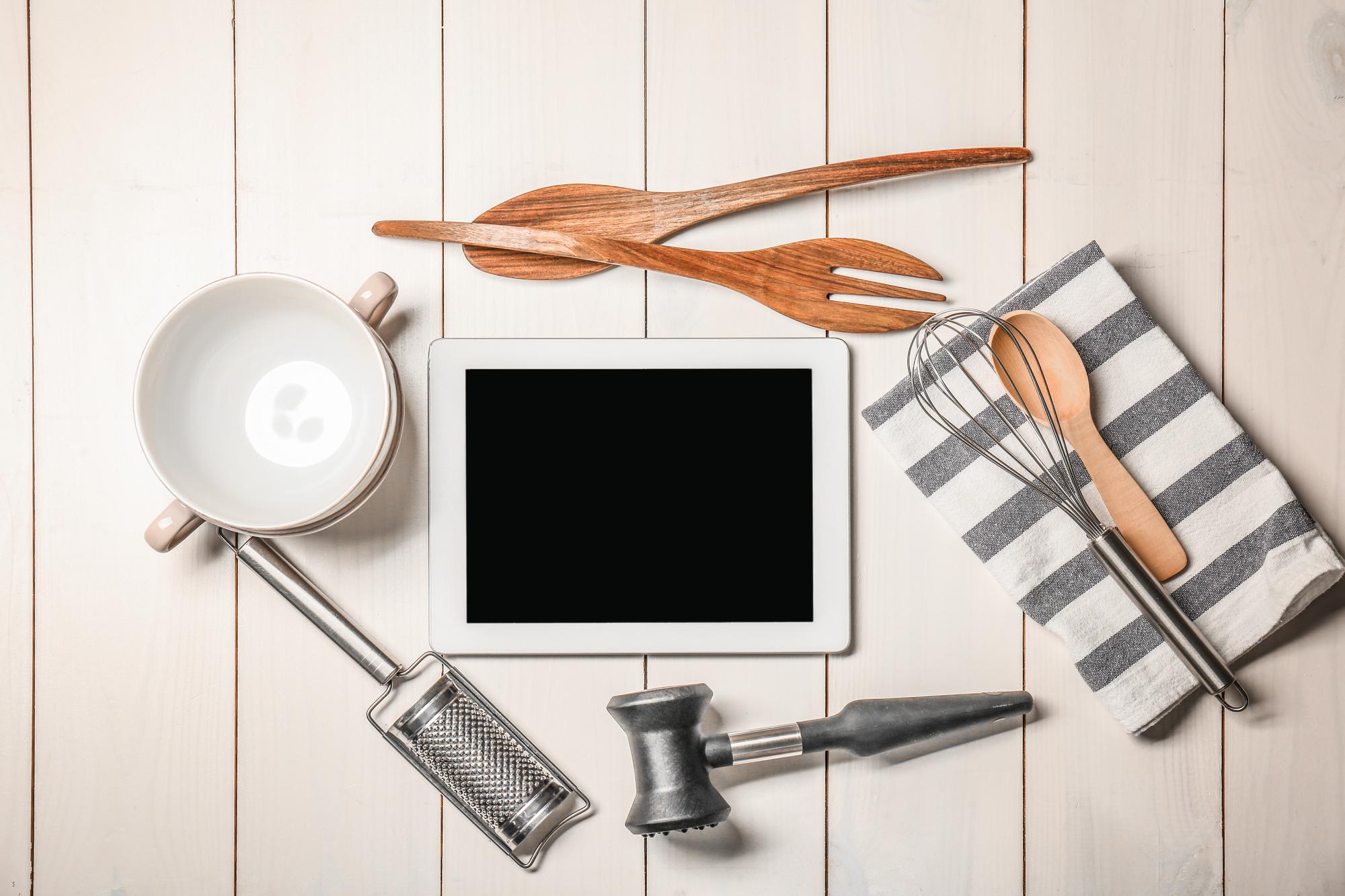 Flat lay of kitchen tools and recipe notes